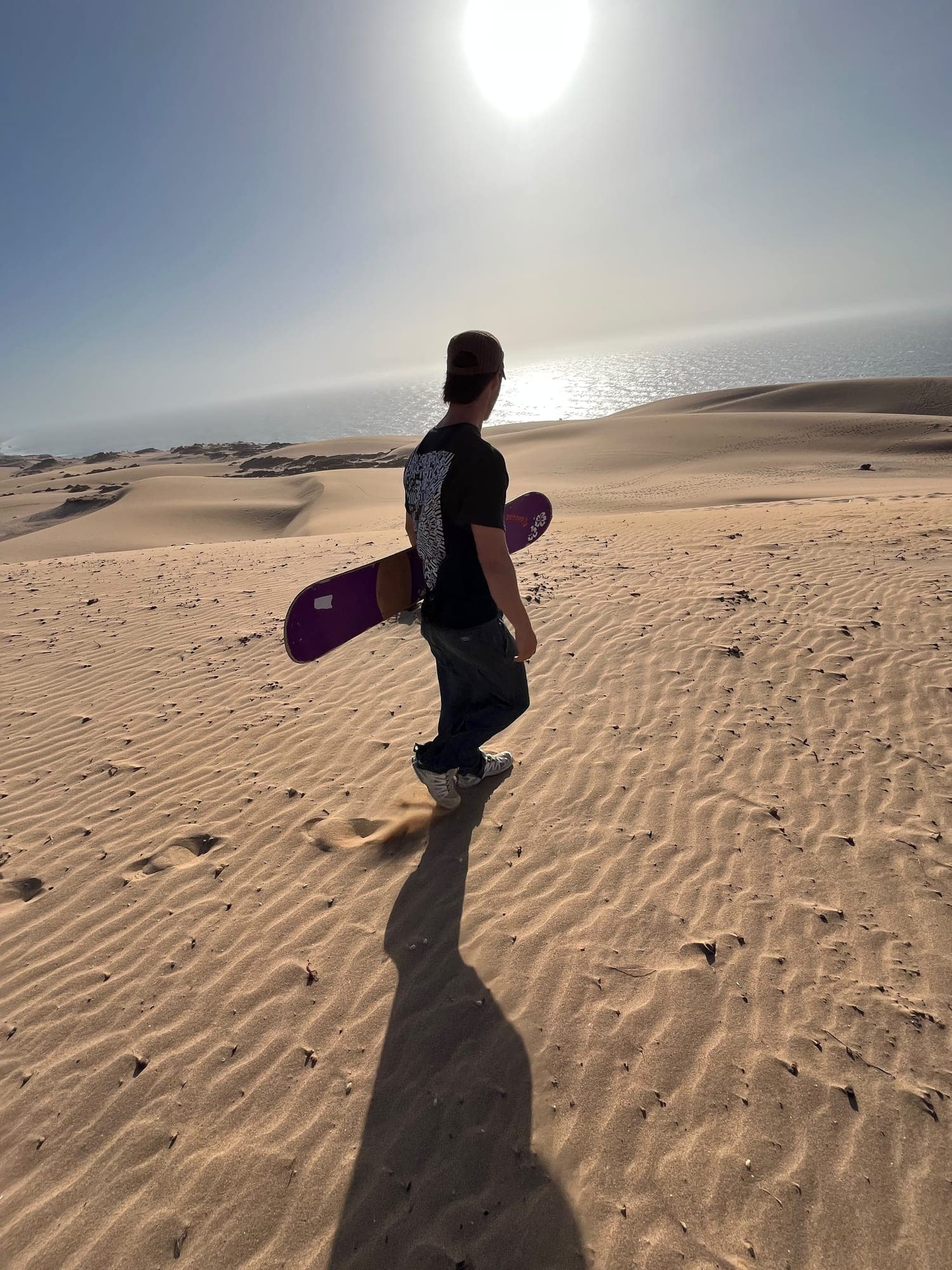 Rippled Timlalin dunes running down to the sunlit Atlantic Ocean north of Agadir